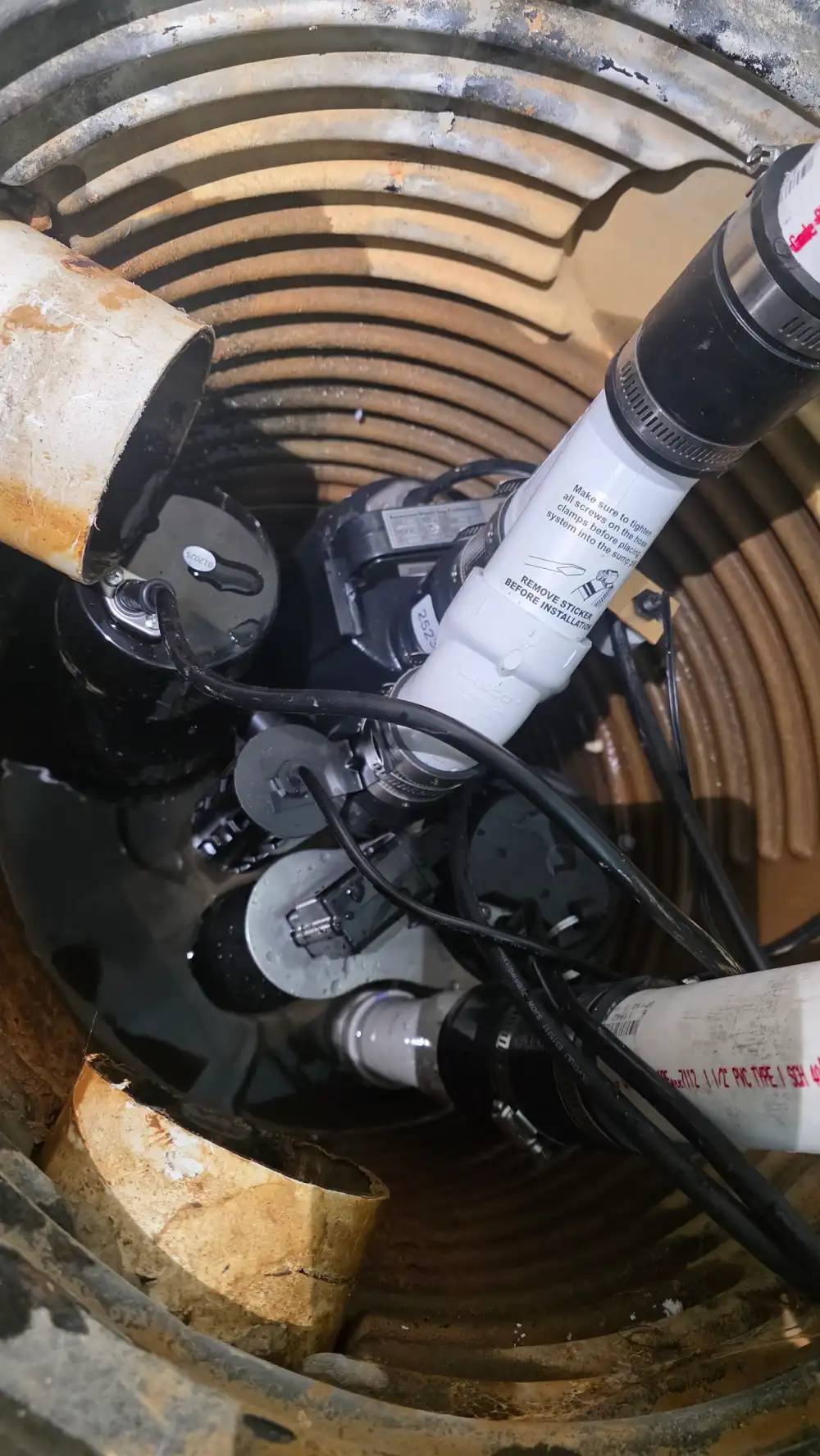 Sump pump failure during heavy rain in Lowell causes basement flooding